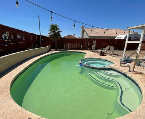 Backyard pool before renovation without modern features